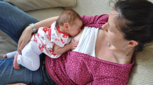 Woman breastfeeding lying down