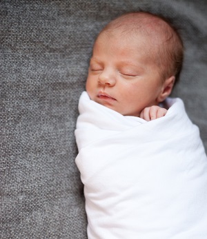 wrap baby in swaddle