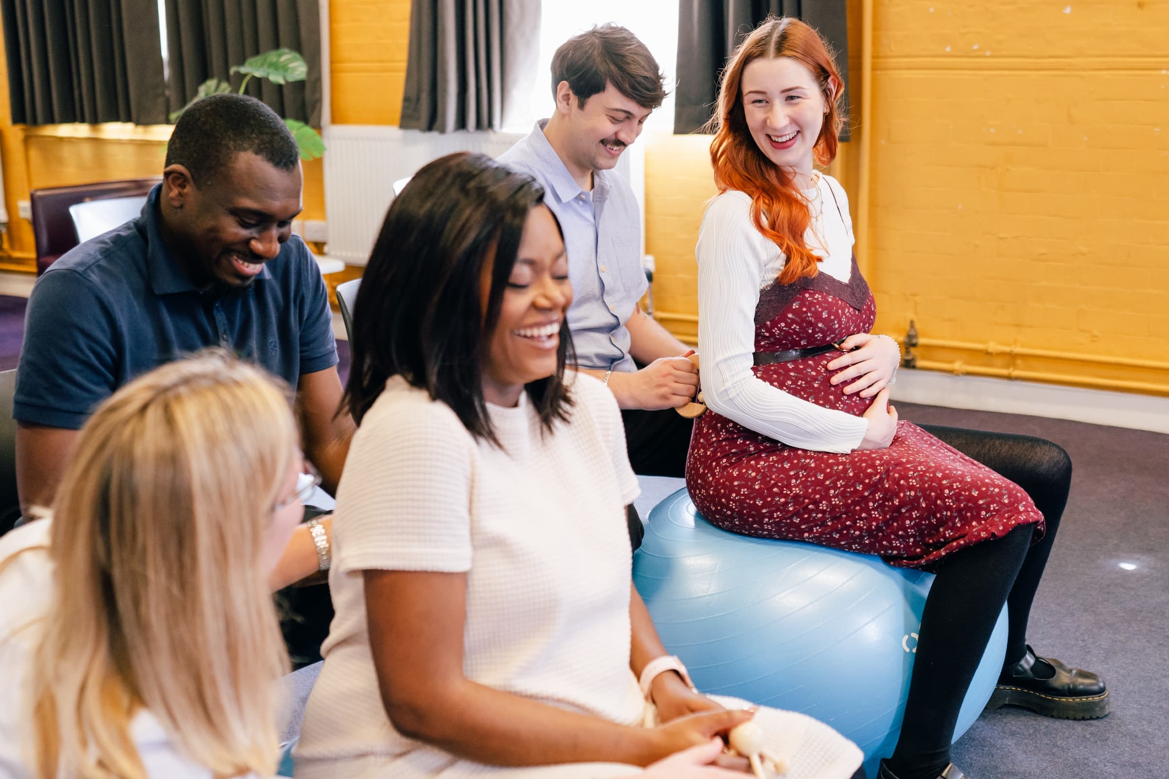 Two couples at an antenatal class with course leader