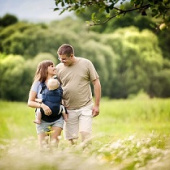 Couple with a baby in a carrier