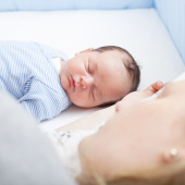 mum lying down with baby