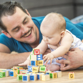 Dad playing with baby