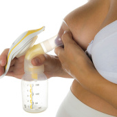 woman expressing breastmilk