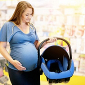 Pregnant lady buying car seat