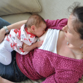 Woman breastfeeding lying down