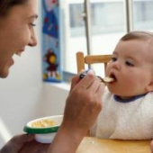 Mother feeding baby