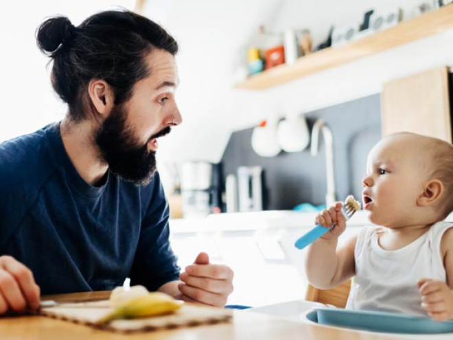 dad and baby talking and eating