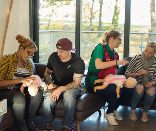 Parents learning first aid