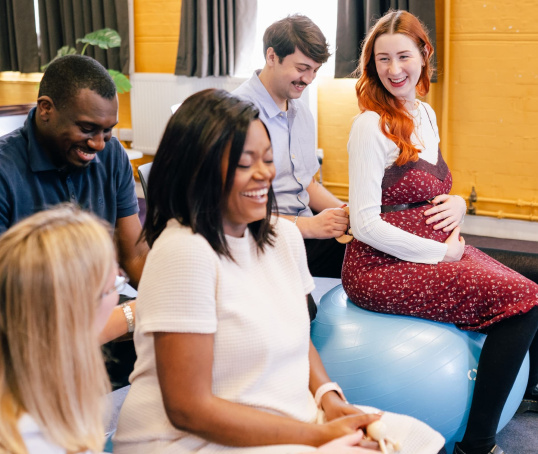 Two couples at an antenatal class with course leader