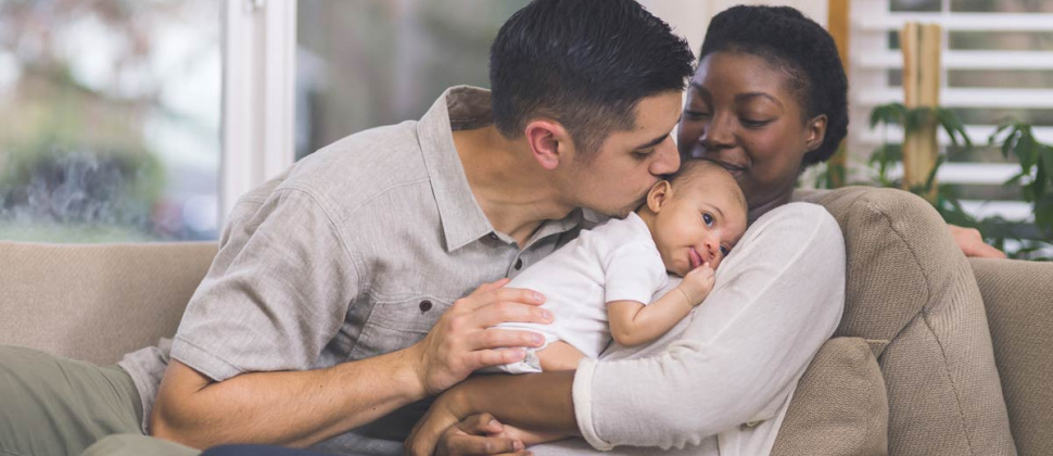 Parents holding baby