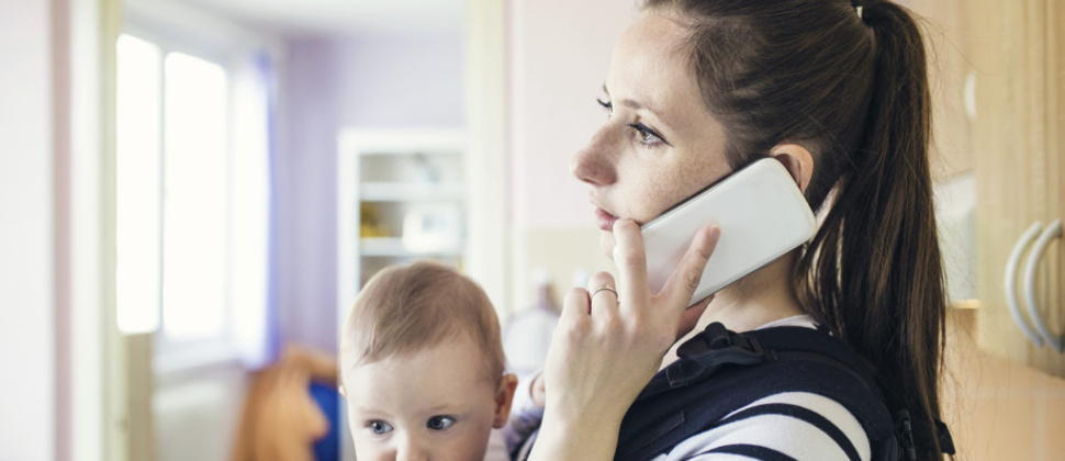 Woman with baby on phone